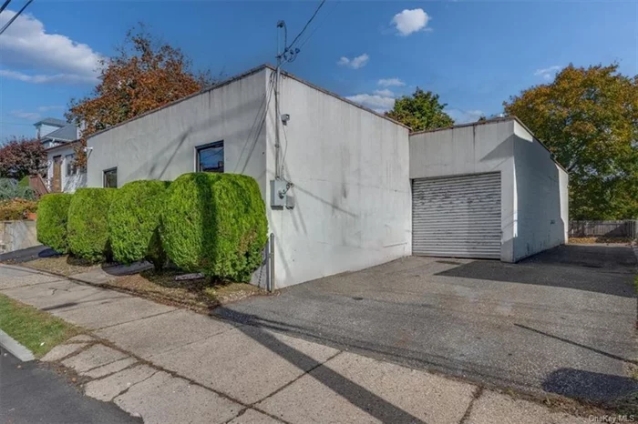 The property is improved with a freestanding 1 story concrete block with stucco veneer building built c. 1952 on a level, at grade, lot with a blacktop driveway which leads to parking for 4-5 vehicles in the rear of the building. The building has a lobby with two rooms for office space, a lavatory and warehouse space. The warehouse ceiling height is approximately 10&rsquo;3. The warehouse is accessed through the office space or through a manual roll up door (8&rsquo;10 w X 8&rsquo;2 h) which is in front of the building. There is also a manual roll up door on the rear of the building that is currently covered over with sheetrock in the interior of the building. Property is located in a residential neighborhood and is a legal non-confirming Warehouse with C.O. for Warehouse Storage/Distribution. Please verify use with the Village of Port Chester.