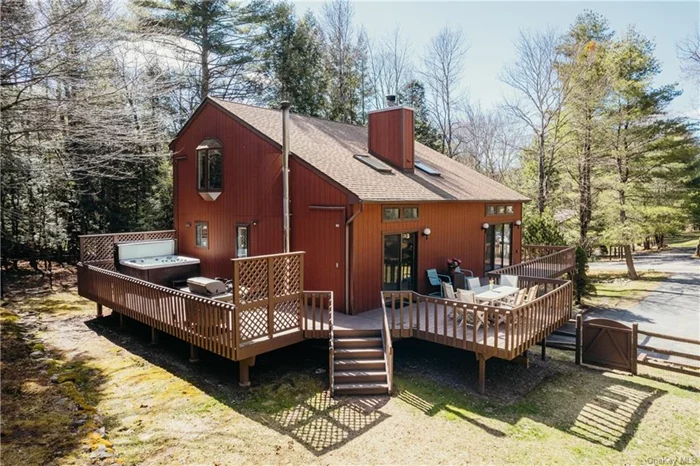 Looking for a turnkey upstate escape less than 2 hours from NYC? This beautiful contemporary home has so much to offer with 1900 sq feet on two floors plus an additional 832 sq feet and attached garage on a lower walkout level. The home features an open concept floor plan, cathedral ceilings, a double-sided fireplace and plenty of natural sunlight. There are two sets of sliding glass doors that lead out to a spacious wraparound deck which is home to a new hot tub and includes stairs that lead down to a level fenced-in yard with privacy provided by the surrounding woods. The home has received many new updates including a renovated kitchen, whole house generator, and flooring. Located on a quiet road on the edge of the Smallwood community, a low optional annual fee for access to a beach area for swimming and access to clubhouses, multiple sports courts and scheduled events for all ages. Smallwood also has a dog park and hiking trails with a stream & waterfall to enjoy. Short drive to waterside restaurants, Bethel Woods Performing Arts Center, Lake Superior State Park, Toronto Reservoir and much more! Whether you are looking for a full-time or second home with potential for short term rentals, come be part of the Western Catskills!