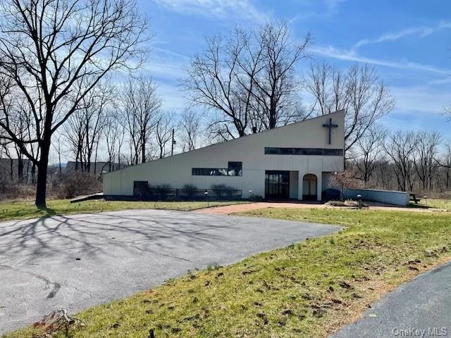 Discover a unique opportunity with this Contemporary Church on over 5.23 acres that offers the potential for a Stylish Modern Home conversion. From the flow to the adaptable setup, this space is meticulously crafted to effortlessly work for both a Church and a Contemporary Home. This property has 4 Levels, a Spacious Entry Foyer, High Ceilings adorned with Skylights, Abundant Natural Light, and a Loft Area overlooking the Expansive Main Area with many possibilities. New Roof - 2019. Gas Boiler with Indirect Water Heater installed in 2019. The property may be subdividable with Town approval. The property is in a Municipal Water/Sewer District. Currently, the property has Municipal Gas, Septic, and Well. Large Paved Parking Area, Driveway, and Brick Walkway. Private and Spacious Backyard. Convenient Location, Close to Metro North, Shopping, Restaurants, Schools and Recreation.