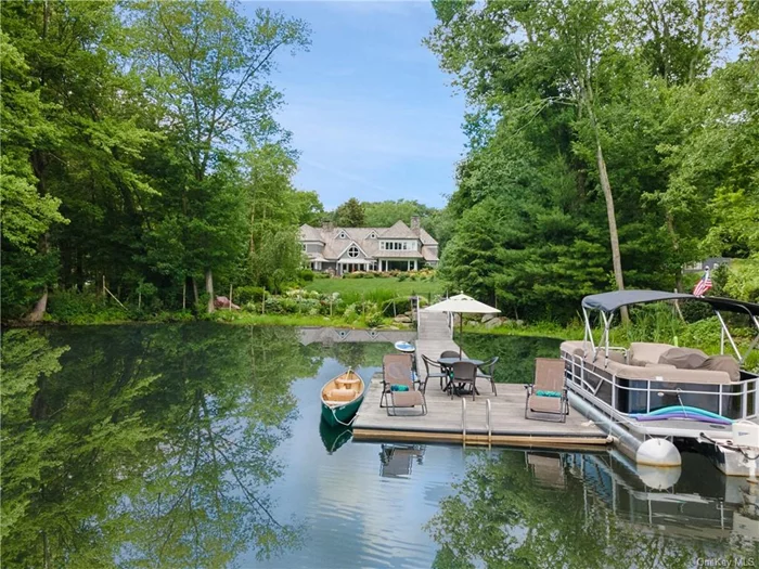 Spectacular Nantucket style waterfront directly on Blue Heron Lake with breathtaking views. This country home is gated, fenced and completely private with truly beautiful land, gardens and fabulous dock, pool and pool house. Blue Heron is a private, 45 acre spring fed lake with crystal clear water for swimming, boating, fishing and ice skating in winter. There are only 13 private homes on the lake and no public access. The open front-to-back entry with water views leads to spacious great rooms made for both entertaining and everyday family living. The lovely chef&rsquo;s kitchen and top-of-the-line baths make the house a joy to be in. This is the perfect location under one hour from NYC, moments to the charming town of Scotts Corners for dining and shopping, amazing cultural institutions and year round recreation with the Henry Morgenthau Preserve on the north end of lake for hiking and cross country skiing. Brand new cedar shingle roof!