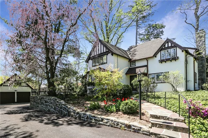 This beautifully renovated and meticulously restored home is set on more than a half-acre of stunning, private property in the sought-after Fox Meadow neighborhood, just a short walk to Scarsdale Village, High School, Metro-North Train station, shops and tennis club. The first level features a formal living room with fireplace and French doors to the porch, dining room, renovated eat-in-kitchen with a gorgeous sunny dining area overlooking the yard and access to a patio, family room with fireplace (being converted to gas piror to occupancy), library and powder room. The second level boasts a spacious master suite with walk-in closet and en-suite bath plus three additional bedrooms with a hall bath. The third level includes a bright bedroom, hall bath and storage. The lower level includes laundry, utilities and storage. Detached two car garage with storage above. Large level yard with beautiful plantings. The windows and hardware throughout this home were lovingly restored and the charm of the original features maintained. Owner has recently replaced roof, upgraded electric, reinsulated the pipes, installed central air and maintained this home meticulously. An A+ rental!