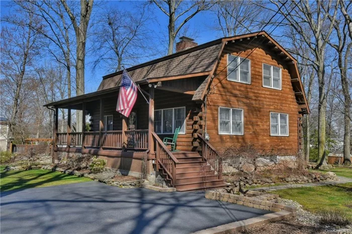 Come view this amazing authentic log home custom built by the sellers with love, pride and care. Great location retreat. Only 24 miles to NYC. As you drive down the long private driveway,  the rocking chair front porch welcomes you home to unwind surrounded by nature and beautiful landscaping. As you enter, the rustic wood beam ceilings and walls create a comforting and warm atmosphere in the spacious living rm with wood burning fireplace and the open kitchen and dining area for family gatherings. The kitchen was recently renovated with ample cream colored cabinetry, center island, coffee bar, stainless steel appliances and granite counters. A large two level deck is perfect for entertaining and convenient powder rm complete the first floor. Retreat upstairs to a spacious primary suite with vaulted wood beam ceilings and ample closet space. Additional two bedrooms with vaulted ceilings and full bath. The lower level offers two additional finished areas for family room or craft area. Enjoy outdoor activities in your level backyard with room for a pool. Enjoy tinkering in the oversized shed with electricity plus an extra storage shed. WELCOME HOME TO THIS UNQIUE AND CAPTIVATING HOME.