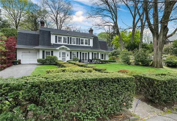 Nestled in the heart of the historic neighborhood of Fieldston in Riverdale, this elegant dutch colonial home sitting on a double lot (total of 0.32 acres) offers a perfect blend of classic architecture and modern comforts. As you approach the property, you are greeted by a manicured front lawn and a welcoming facade adorned with traditional architectural design. The allure of the exterior is matched only by the beauty that lies within. Upon entering the home, you are immediately struck by the grandeur of the foyer, illuminated by natural light pouring in through living room windows. Gleaming hardwood floors lead you through the spacious living room, where a cozy fireplace invites you to unwind on chilly evenings. A set of double french doors lead you to the southern facing sun-room. This room receives sunlight all day long with windows looking out on the spacious side yard and rock formations Fieldston is known for. This cozy room is the perfect place to have morning coffee before tackling your day or an evening cocktail to unwind. The adjacent formal dining room, with its large windows has room for a large dining table and sets the stage for memorable gatherings with friends and family. The recently renovated chef&rsquo;s kitchen boasts high-end stainless steel appliances, granite countertops, and ample storage space, making meal preparation a joy. Upstairs, the second floor features four generously sized bedrooms, each offering abundant closet space and large windows that flood the rooms with sunlight. The master suite is a tranquil retreat, complete with an en-suite bathroom featuring a large soaking tub. Conveniently located just steps away from local shops, restaurants, and parks, and with easy access to public transportation, including the 1 train at W 242nd Street, Metro-North railroad and express buses to Manhattan