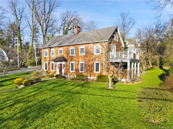 Inspired by the shingle style homes of Nantucket, this sunny center hall Colonial is not to be missed. This wonderful home offers spacious areas for the family to gather and the privacy of six bedrooms when quiet time is needed. The first floor was completely renovated in 2012, including a custom-designed, eat-in kitchen with two dishwashers, a farmhouse sink and bar sink, 1.5 refrigerators and a 6-burner cook top and double oven. In addition to a gracious formal dining room, a second eating area was added with seating for eight under a 12-foot cupola and a sliding glass door, providing access to two outdoor covered patios. A home office with extensive built-ins was added, allowing for at-home work, as were French doors from the living room to the outdoor patio. The lower level includes a family room, a generous laundry, a powder room, and an 800-bottle wine cellar. The finished den in the lower level is 300 square feet and not included in total square footage. Located in one of the Village&rsquo;s desired neighborhoods, close to award-winning Bronxville schools, the train station and town, this home has it all!