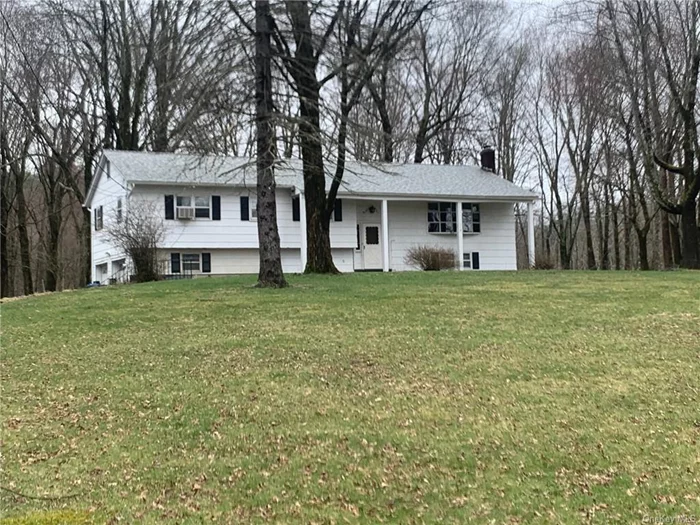 This very large bilevel sits on 1.8 private partly wood acres that is 2 minutes to Route 17 (now expressway) 8 minutes to the Middletown mall and 15 minutes to Garnet Hospital.The owner is also selling 24.5 acres that is behind the house. MLs 6301731 The master bedroom has a walk in closet and private bath. There are three additional bedrooms and bath all on the same level. This is unusual for a High Ranch/ Bilevel. Every room on the main level has oak floors that when refinished will be beautiful. 1The kitchen has more than enough room to have a table and chairs if you don&rsquo;t want to eat in the formal dining room. The downstairs Family room/Rec room is a great size for parties and family gatherings There is also a powder room in that area. The roof was replaced approximately 2 years ago. This house has solid bones that needs some updating and loving care..