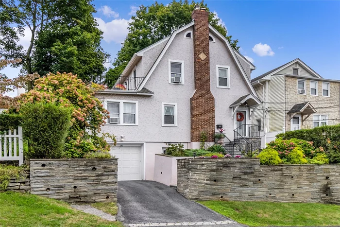 This beautiful stone home is one of a kind. Updated through the years the house retains its character and charm while everything has been updated. First floor boasts Living room/fireplace/formal dining room/heated sunroom - great for a den or an additional bedroom. Bright and sunny kitchen with vain quartz countertops/updated cabinets/porcelain floors and stainless steel appliances. Fully renovated bathroom. Second floor shows off the primary bedroom with access to a beautiful balcony with panoramic views of the city. 2 additional bedrooms/Third floor/additional playroom or office. All oak hardwood floors throughout . Basement is a finished room with a full bathroom and summer kitchen. Ideal mother daughter. Updated roof, windows, boiler, retaining wall, steps etc. all done between 2011 and 2023. Large outdoor patio/Adjacent parcel offers quiet private grounds that reflect European landscaping. 5 min walk to Metro North. This home has it all.