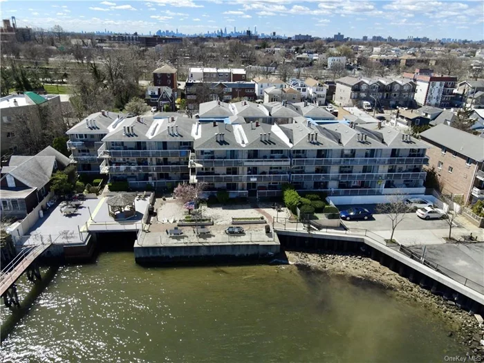 Waterfront property in Throgs Neck Area two-bedroom 1 bath CONDO nestled between Bicentennial Veterans Park and Weir Creek also known as Beach Cove Estates Condominiums,  The apartment consist of a large living room,  with a working fire place, a formal dining Area with a bright view of the sun rise and a walk out to balcony facing Ocean. Unit has a Large kitchen with plenty of counter space with an open concept of living to the living room, and a walk out Deck. Main bedroom is spacious with a walking closet and separate closet for Washer & Dryer . Unit is in need of minor TLC. Ideal for water lovers this unit is access to ocean, has great potential to become your dream apartment! Will be Sold AS IS!