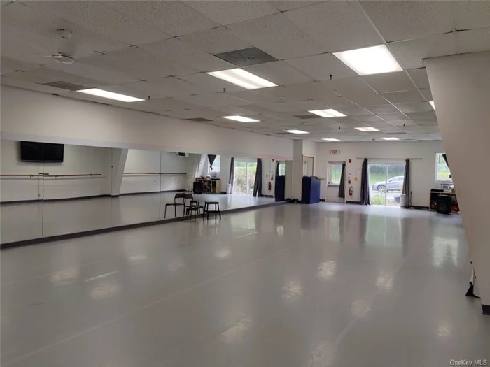 4500 foot space former dance studio , fitness space ample parking a bright well lit space has 3 other rooms central air and its clear span . Also has a kitchen located in village proper walk to post office and restaurants private entrance . Great space 10 foot ceilings
