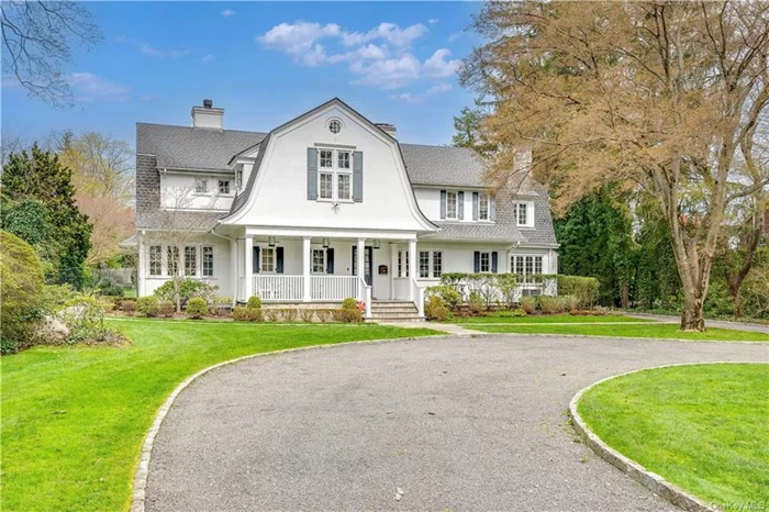 Iconic Scarsdale residence nestled on an acre of perfectly flat parklike land with mature landscaping and pool. The long circular driveway and private setting on sought after Garden Road and surrounded with handsome homes presents a extrardinarily rare opportunity.  91 Garden offers a thoughtful and elegant layout featuring spacious formal and informal living spaces that take full advantage of the spectacular setting. A welcoming front porch leads to an elegant entry foyer, the living and formal dining room with fireplace and butler&rsquo;s pantry designed for elegant entertaining. A modern Eat in kitchen opens to the bright and spacious family room with tall windows and glass doors to the patio and spectacular property. The first level also includes a formal powder room, a charming and cozy library with wood burning fireplace, a laundry room, a spacious mudroom, a second powder room and an oversized two car garage.  On the second level, the primary suite features cathedral ceilings, a separate sitting/dressing room also with vaulted ceilings and a large Modern Primary bathroom with dual vanities, jacuzzi and separate shower. On this level there are also 3 additional spacious family bedrooms all with ensuite bathrooms, and a guest wing with an additional bedroom, an office and a full bath. This area offers a perfect place to work from home with views overlooking the sublime grounds. The property was thoughtfully expanded and completely updated in 2012 including a modern kitchen, new baths and new windows and is fitted with a full house generator to ensure a worry free lifestyle. The walkout lower level (1, 416 square feet) offers amazing versatility and generous spaces including a large playroom/recreation room, gym and flexible space including a potential media room. This amazing property presents a very rare opportunity to enjoy privacy, the amenities of a perfect flat lush and landscaped one acre setting with a 22 by 55 pool with Spa, bluestone patio, fire-pit and separate pergola. This house is the complete package awaiting a savvy buyer.