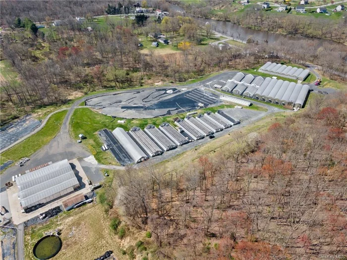 This 40+ year business has operated as a grower of herbs, flowers of all kinds to the mid-to high end markets throughout the tri-state region, as well as some local nurseries. With over 100, 000sf of covered and heated quonsets and gutter connected greenhouses, most are heated with propane, some with oil. All the mechanicals are in great condition, with 5-1M BTU furnaces servicing the main facility with in bench hot water heat. The electric is comprised of 2- 400 amp services, together with an 80W generator with an automatic transfer switch services facility. There are 5 active wells providing irrigation throught the 35 acre parcel. All wells run to and from a water treatment room (separate building) with an H.E. Anderson fertilizer and acid (regulate PH) injection system. Access to clear and/or fertilizer water to all areas of the facility. Heating, cooling, shading, etc, computer operated. There is a 1200sf office space fully functioning near the top of the facility that handles billing, receiving, etc., also adjacent to the loading platforms. Perfect for the existing grower to expand their capabilities, or newer entrant to the business. Plenty of room to expand, grow more varieties, vegetable crops, with easy access to NYC transportation. There is an agricultural exemption and taxes are reasonable at under $12, 000/year and the RA-.5 acre residential zoning is still in effect.  Great opportunity for the enthusiast.