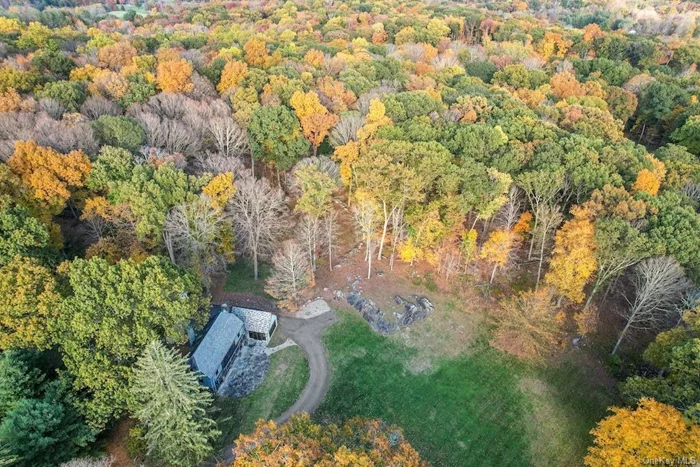 This is a unique 21-acre Estate Property complete with the original 1919 Carriage House newly renovated into a gracious 3-bedroom home, along with a spacious 2-story guest cottage, on the secluded 4-acres. The additional 16-plus acres is fully approved for 4 separate building lots, to do with as you wish. The land itself is forested by 150-year-old trees, convenient to pristine hiking trails, Bedford Riding Lanes, and local community parks. Located between historic Bedford Village and modern Mt Kisco, it is convenient for major highway access, commuter trains, shopping, and schools.  The Carriage House entry leads, on the left, to an open-concept kitchen transitioning into a contemporary family room, with large double doors for exit to the open terrace, while on the right, the conservatory boasts floor-to-ceiling windows that fill the space with natural light and lovely views of the surroundings. On the second floor, the Primary bedroom suite is complemented with a large sitting room that opens to a covered deck, and connects to its bathroom via a small hallway of mirrored closets. A second smaller bedroom, also with deck access, completes this level. The third floor contains a third bedroom plus two office-sized rooms and multiple storage closets. The guest cottage is notable for it&rsquo;s sunken living room and a 2nd floor bedroom suite opening out to the greenery behind.