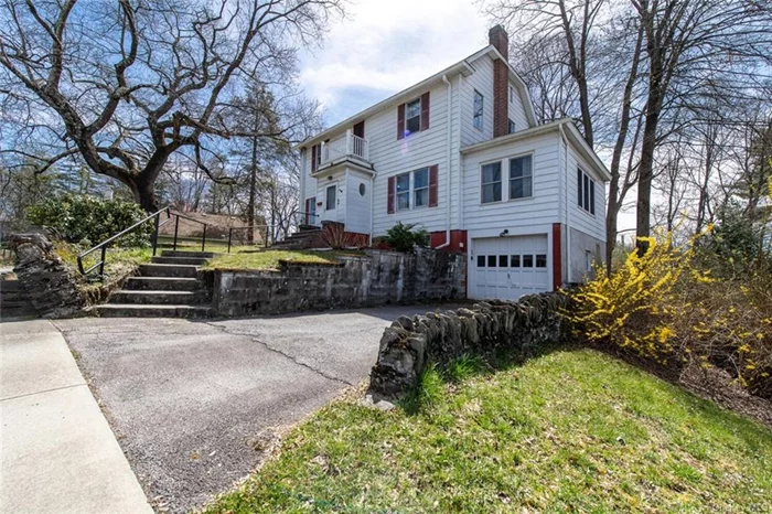 This pretty southside neighborhood boasts inviting sidewalks and winding tree-lined streets. Each home is lovelier than the next. This classic colonial is framed by beautiful mature trees and stately stone walls. A charming vestibule with a circular window placed on each side creates a bright, welcoming entry to this special home. As you step inside, you will appreciate that the original period details have been preserved. You will love the artistic layout of the wood floors, the handsome main staircase and the original door hardware and original light fixtures. The spacious front to back living room is great for relaxing and congregating and the brick surround fireplace enhances the experience. Head out to the three-season room and bring the outside in through the numerous large windows. The formal dining room can accommodate plenty of guests. It offers easy access to an efficiently configured kitchen which boasts loads of cabinetry and plenty of counter space. You will likely be surprised when you discover that there is a full bath on the main level. The upstairs living space includes a spacious primary bedroom with an ensuite bathroom, two additional bedrooms, a nicely renovated full bath and a cozy extra room with a balcony which would make an ideal reading room or office space. Don&rsquo;t miss the walk-up attic. Enjoy spending time outside relaxing on the deck and listening to the birds. This property is conveniently located close to shopping, restaurants, the Poughkeepsie train station, highways, hospitals and all that the fabulous Hudson Valley has to offer.