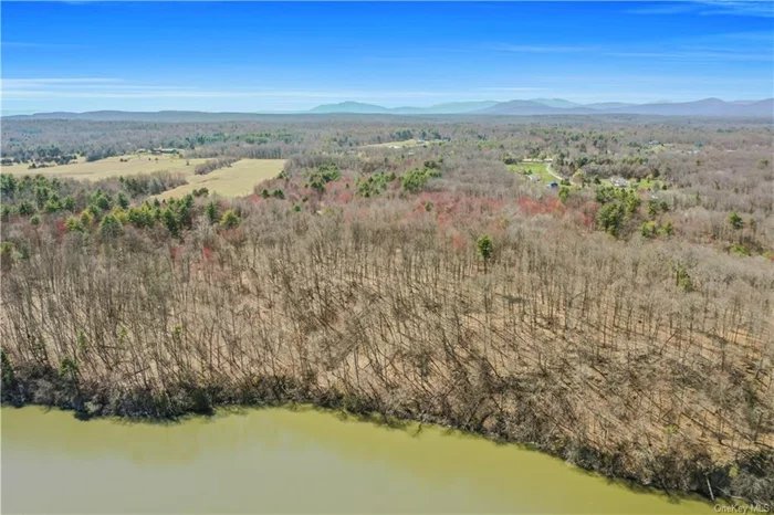 Don&rsquo;t miss this once-in-a-lifetime opportunity to grab one of the region&rsquo;s best 4-season views of the Hudson River. This wide and deep 76+ acre site, located midway between Kingston and the Village of Saugerties and only 2 hours from NYC, features no less than a quarter-mile of prime Hudson River frontage, unobstructed by train tracks or road, plus 2 points of entry from Route 32. A mix of flat wooded fields opening to spectacular hilly terrain as you get closer to the waterfront, the property offers a dramatic bird&rsquo;s eye view of the river plus state lands and tranquil Dutchess County farmland beyond. Zoned for Low Density Residential development (2-acre minimum lots) close to the river, and Moderate Density Residential development (1-acre minimum lots) on other portions, the parcel offers a diverse range of potential investment options, with a long and logical road path already roughed in from Route 32 all the way to the waterfront. Secluded and quiet, the site is also perfect for a single dream home, or compound, with a .65-mile approach through flat woodlands leading to the stunning and panoramic hillside perches above the Hudson.