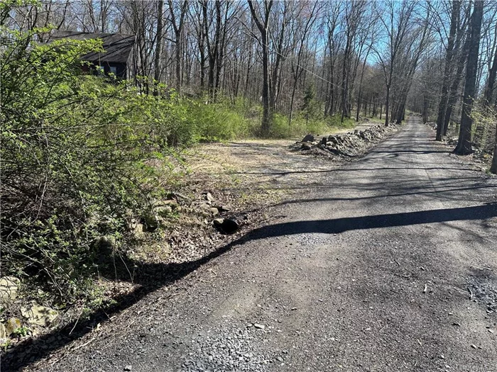 In the country, off the main road, partly cleared 5 acres to build the home of your dreams! The engineer&rsquo;s site plan was originated in 1997 and updated in 2010 shows proposed sites for septic and well. There is electric on the site. Driveway has been excavated and has fabric base.