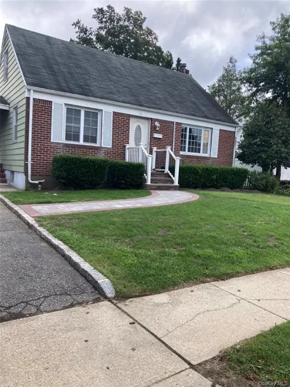This renovated single-family home in Huntington Station offers modern features such as a renovated kitchen and bathroom, hardwood flooring throughout, and a brand new HVAC central heating and cooling system. The presence of a functioning boiler ensures reliable heat and hot water. Additionally, the detached garage and driveway provide convenient parking & storage options for residents and guests.  Its close proximity to the LIRR train and transportation offers easy access to commuting options and other great amenities in the area. Highlights are the brand new kitchen shaker cabinetry with Quartz countertops. It not only offers a sleek and contemporary look but also provides a durable and easy-to-clean surface for food preparation. This home offers a functioning dining room as well as a living room.  The renovated bathroom adds a touch of luxury and functionality to the home. It includes new fixtures, tiles, new lighting & a modern vanity. Providing a luxurious retreat from your daily routines with a deep soaker tub. The home also boasts an abundance of windows, allowing natural light to flood the interior and creating a bright and welcoming atmosphere. This home provides ample space for relaxation and privacy. The hardwood flooring throughout adds a touch of sophistication, while the finished basement offers additional extra living space that can be customized to suit your needs. It can be configured as a family room, home theater, gym, office, a guest suite, or a Mother-daughter, depending on your preference. A separate outside entrance provides this convenience. The backyard with the patio offers amble place for outdoor dining, entertaining guests, or simply relaxing. Situated close to shopping and restaurants, whether you&rsquo;re looking to explore the local dining scene or indulge in some retail therapy, everything you need is within reach.