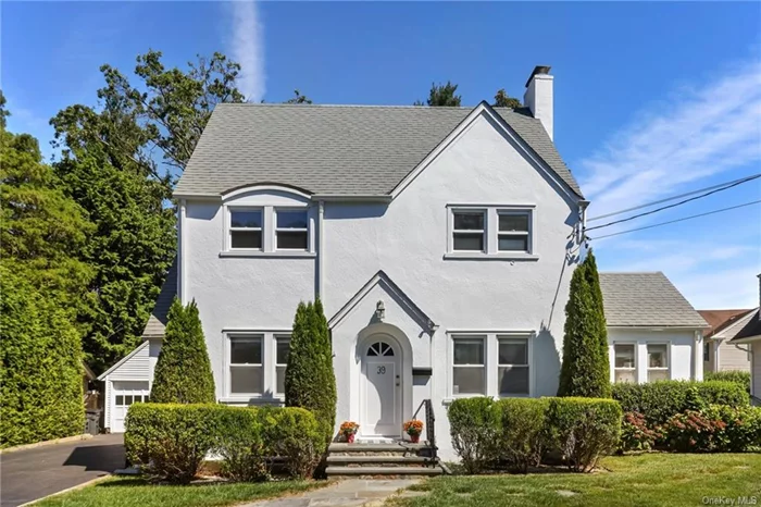 The one you have been waiting for! Charming Tudor style single family home with modern updates and central location in Station Park. This home offers a cozy family room with wood burning fireplace and an enclosed sunroom off the family area with french doors that can be used as a home office or additional play area. The newly renovated kitchen opens to the dining area and provides access to the rear yard with ample space to add a first floor powder room. All new stainless steel appliances, quartz countertops, and white cabinetry complement the space. Upstairs you will find a newly renovated bathroom with bathtub and three spacious bedrooms with ample closet space. There is also large attic space, great for storage. The lower level adds approximately 653 sqft of unfinished space, including laundry. The backyard has plenty of room to play and entertain and the two car garage is a rare find! The best part is that you can stroll to Harrison schools, the Metro North train station, parks, public library, and downtown which is bustling with new restaurants and cafes.