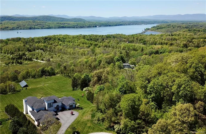 Welcome to your very own slice of Hudson Valley heaven! This spacious home offers breathtaking year-round views of the Hudson River and Catskill Mountains. On 5 acres of meticulously landscaped grounds, this custom-built, 8, 293 sq.ft home lives like a 5 bedroom home, 4 full bathrooms, and 2 half bathrooms. Step inside to discover a recently-renovated interior featuring a fully-equipped chef&rsquo;s kitchen with island seating, seamlessly flowing into a cozy living room area with a gas fireplace. Adjacent to the kitchen, you&rsquo;ll find a formal dining room, a second living room, three bedrooms, two full bathrooms (one with a luxurious jacuzzi hot tub), a pantry, laundry room, and two powder rooms. Outside, a sprawling travertine patio beckons, offering an ideal setting for entertaining guests while soaking in the stunning river views. Take a dip in the 40+ foot long in-ground heated pool or unwind in the hot tub, easily accessible from both the patio staircase and the walkout lower level.