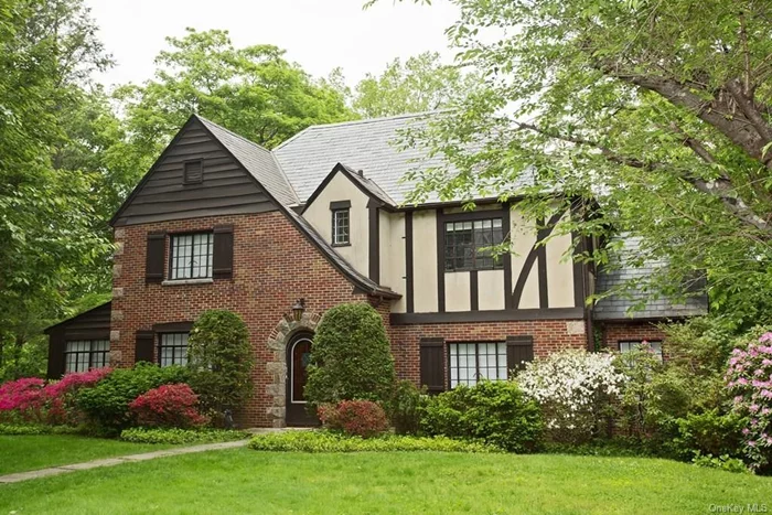 Beautiful spacious brick and stucco Tudor in the heart of the Grange in Greenacres, considered to be one of the finest neighborhoods in Scarsdale, featuring many estate homes. This lovely rental is in a very tranquil setting. Situated on .35 acre, this gracious house features four spacious bedrooms and three newly renovated bathrooms. The expansive tastefully renovated kitchen boasts a SubZero refrigerator, Bosch convection double ovens, Bosch dishwasher, and 5-burner gas Bosch range top. All the appliances including the sink are stainless steel. There are gleaming hardwood floors and central air conditioning throughout the house. The rear hall leads to an inviting deck overlooking mature trees and the backyard. There is also a ground level patio. The floors have been refinished and the house has been painted. Completing the picture is a 2 car attached garage. A gorgeous lush park is less than one minute walk. Location, Location, Location!