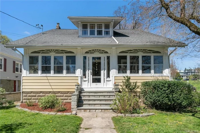 Welcome to this lovingly maintained Craftsman-style home, circa 1910, in historic Ossining, with a 2-car garage. Original woodwork and beautiful hardwood floors throughout are timeless and lend character. As you enter, the enclosed sunroom offers a tranquil space to enjoy the outdoors. The spacious living room, drenched in natural light, features a charming window seat. The formal dining room provides an elegant setting for entertaining and flows seamlessly to the kitchen, mudroom, and door out to backyard. Upstairs, both the primary bedroom and 2nd bedroom boast two walk-in closets, offering plenty of storage. An additional room with built-in drawers is an ideal office. The basement houses laundry facilities and a 2nd full bath. Outside, the private, level backyard is perfect for relaxation and outdoor gatherings. Conveniently located with easy access to Nelson Park, village shops, restaurants, the Hudson River, and both the Ossining and Scarborough Metro North Train Stations.