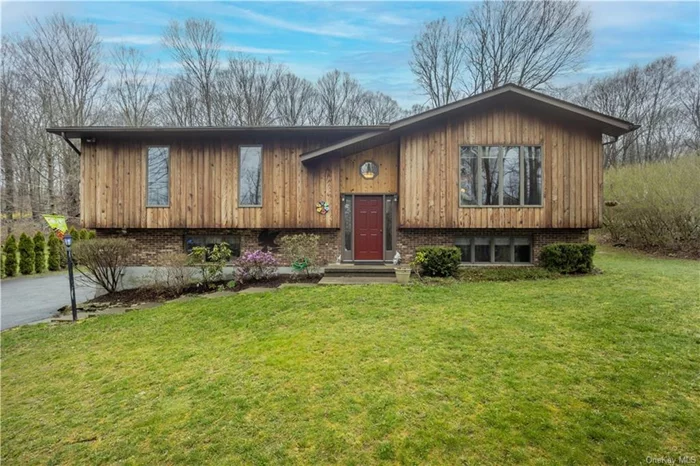 Welcome to your dream home in the heart of Holmes, NY! This meticulously maintained raised ranch boasts pride of ownership with its single owner and thoughtful updates throughout. This home is conveniently located to MTA lines, and major highways, plus minutes from shops, restaurants, and schools.  Nestled on a sprawling 1.73 acres, this charming residence offers the perfect blend of comfort and convenience. As you arrive, you&rsquo;re greeted by a long driveway providing ample parking space, leading to a one-car garage equipped with a handy workbench and bonus workroom.  Step inside to discover a newly updated interior adorned with modern finishes and stylish accents. The main level features a spacious living area, complemented by a gourmet kitchen showcasing sleek appliances and ample cabinetry. With three bedrooms and three bathrooms, including a luxurious primary bedroom suite complete with a private library and convenient laundry room, there&rsquo;s plenty of room for the whole family to unwind.  Entertain guests or simply enjoy the serene surroundings on the expansive Trex decking, overlooking the lush backyard dotted with two storage sheds, offering ample space for all your outdoor essentials.  But the allure doesn&rsquo;t end there. Descend to the finished basement, where you&rsquo;ll find a versatile living space complete with a full bathroom and a convenient Murphy bed, perfect for accommodating overnight guests or creating a cozy retreat.  Whether you&rsquo;re seeking a peaceful oasis to call home or a welcoming space to host gatherings, this Holmes gem truly has it all. Don&rsquo;t miss your chance to make this exceptional property yours  schedule a showing today!