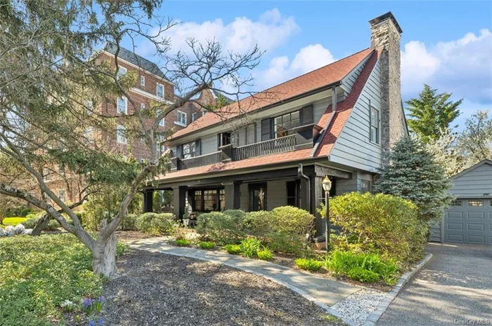 This exceptional colonial home is centrally located in the village of Bronxville, 2 blocks away from Bronxville School and minutes to the Metro-North Railroad station and in close vicinity to Scout Field County Park and Pondfield Rd shopping and restaurant area.  From the moment you arrive, you&rsquo;ll be captivated by the charm of this home with its grandiose pine tree, winding pathways, and a spacious front porch to enjoy life with family and friends. Step inside to find a wealth of enchanting features, including coffered ceilings in the formal living and dining rooms, a fireplace, and sunroom with French doors leading to a rear patio. This home is made to entertain guests.  The heart of the home is the kitchen, a culinary masterpiece featuring an embellished tin tile ceiling, custom lighting and cabinets, marble and granite countertops, and a La Cornue stove with a double oven and warming drawer. A cozy, sun-drenched breakfast nook is the cherry on top.  Retreat to the spacious master bedroom, complete with a renovated full bath featuring luxurious amenities, including a claw foot tub. Two additional bedrooms share a connecting full bath, while a den with French doors opens to a second-story terrace, the perfect space to relax and unwind.  The third floor offers versatility with an additional bedroom, a full bath, and ample storage space. For added leisure, the lower level features a recreation and a laundry room. Central air conditioning ensures year-round comfort, while a one-car detached garage and driveway provide convenient parking.  Experience refined living in this meticulously maintained home, conveniently located just 35 minutes by train from Midtown Manhattan, and 50-minutes by car.  Finally, local legend says that this beautiful home was once occupied by Academy award winning actress Anne Bancroft.