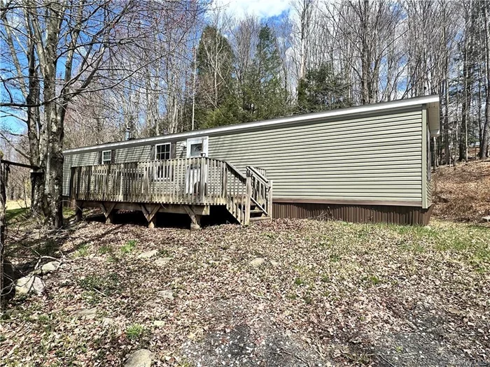 Enjoy what nature has to offer. This 2015 Manufactured home is tucked into the woods away from the road where you can find a private and peaceful setting. The front deck is a perfect place to kick back your feet, soak up the sun and admire nature. Sitting on 2 acres of private woods, this home offers an open floor plan and includes 3 bedrooms and 2 full bathrooms. Conveniently located, it is just a short drive from local grocery stores, dining and gas stations. If you are looking for a quiet, rural living space or find yourself a nature lover, this home may be what you&rsquo;re looking for.