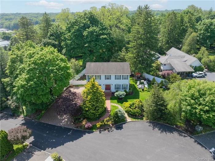 Welcome home to this stunning colonial nestled at the end of a tranquil cul-de-sac. Impeccable craftsmanship and elegance define this residence boasting hardwood floors and crown moldings throughout and marble tile entryway. The kitchen features stainless steel appliances and granite countertops, perfect for culinary enthusiasts. Enjoy modern comforts with central air and state-of-the-art video cameras and alarm devices for peace of mind. Step through the sliding doors onto the deck and into the sprawling yard, adorned with apple, cherry, plum, mulberry, blueberry, raspberry, blackberry, fig and grape trees and flowering trees a true oasis for entertaining or simply unwinding in nature&rsquo;s embrace. Indulge in convenient living with easy access to major roadways and public transportation, making commuting a breeze. Nearby, explore a plethora of shopping options including Whole Foods Market, The Westchester Mall, and Bloomingdales, catering to all your needs and desires. Arrive home to a spacious 2-car garage, with one side customized to accommodate tall vehicles, complemented by a pink Cambridge paver driveway offering ample parking space. The entire property is fenced with an additional privacy fence separating the driveway from the backyard, ensuring your complete privacy. Experience peace of mind with the Kohler generator installed in 2022, ensuring uninterrupted power supply. This home includes storm windows adding protection and energy efficiency. Discover the epitome of refined living in this exquisite home.