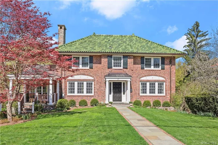 Scarsdale Greenacres gem! Expanded and updated by architect owner, this Center Hall Brick Colonial is ideally located on a tranquil street close to the Greenacres school. This elegant Colonial boasts a beautiful layout with over 5000 square feet of living space, five generous sized Bedrooms on the second floor and three full baths and two half baths.The classic layout and open floor plan creates a wonderful flow for everyday living and easy entertaining. The kitchen family room addition features a Chef&rsquo;s kitchen, oversized island, high-end appliances including a Viking 6 burner stove, oversized eat-in area and family room with a gas fireplace. French doors open to a beautiful bluestone terrace with views of the spacious property with perennial gardens and a wooded preserve beyond. The living room with a wood-burning fireplace adjoins the sunroom which opens to a charming covered bluestone front porch. A tranquil spot to relax with your morning coffee! The exquisite primary bedroom has a 10 foot ceiling, numerous closets and French doors to a balcony overlooking the beautiful yard. The luxurious marble bath has a soaking tub, jetted showers and a radiant heated floor. Four additional bedrooms, 2 new baths (one ensuite) with radiant heated floors complete the second level. The finished walkout lower level has a large recreation room, office, exercise area, half bath and mudroom. Enjoy an oversized 2 car garage plus a third garage for all your cars and gear. Just over a block to the newly renovated, award-winning National Blue Ribbon Greenacres Elementary school, and close to the Metro North train, shops and restaurants. Wonderful curb appeal!