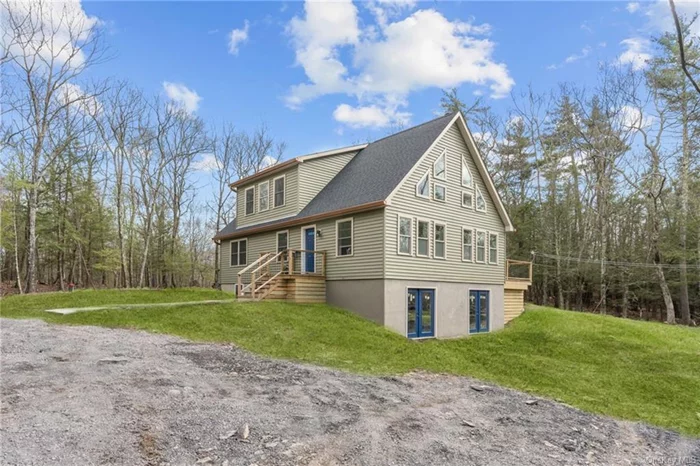Beautiful contemporary home on Band Camp Road in Saugerties, offering mountain views and a design that seamlessly combines functionality with style. Built in 2022, this 1, 820-square-foot home features an open floor plan. Upon entering, a spacious living room with vaulted ceilings and a striking wall of windows that bring in the picturesque view. Flowing effortlessly into a dining area, large enough for holiday gatherings with sliding glass doors leading to a large porch. A well-appointed kitchen is tucked just around the corner, boasting a large pantry, ample cabinetry, stone countertops, and stainless-steel appliances, with a central island providing additional seating or workspace. Also occupying the main floor, the primary suite presents a walk-in closet with a washer and dryer, and an ensuite bathroom with a beautifully tiled shower and double vanity. Upstairs, you&rsquo;ll find two more generously sized bedrooms and another full bathroom. Don&rsquo;t miss the view from the top of the stairs!
