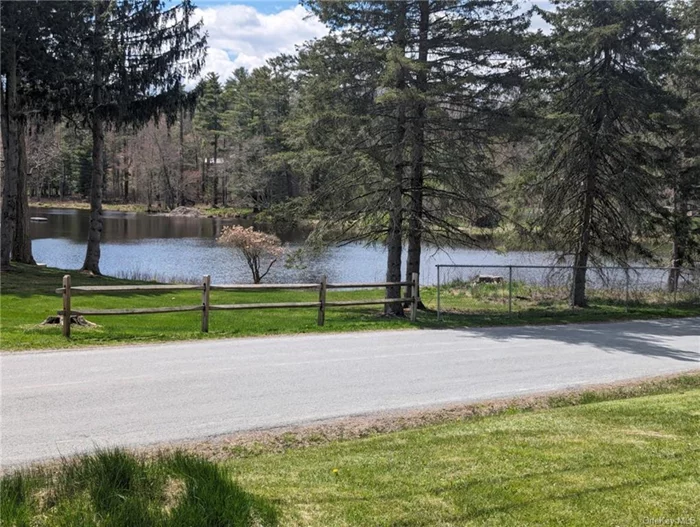 5.2 acres of mostly open level land with a partial view of Kenoza Lake. COLLAPSED house on property will have to be removed by buyer. No representations as to well and septic. Offered AS IS Taxes listed are on house and land.  CAUTION!! NO ENTRY TO BUILDING.