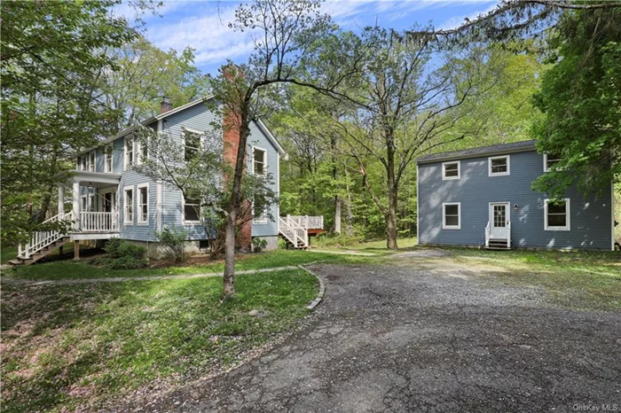Lovely renovated Farm House Colonial with Bonus Artist Studio in Yorktown School District. Two Houses for the price of one! A perfect blend of old and new, fully renovated in the mid-2010s with high-end finishes while retaining much of the charm of the original house. In the main house, a perfectly laid-out entry foyer leads to a formal dining room, wrapping center staircase, and a large formal living room with a wood-burning fireplace and a wall of windows with walk-out doors leading to a large side deck. The Kitchen boasts Viking, Miele, and Subzero built-in appliances including a 3 Package Miele Oven, Convection Oven, and Microwave. Miele electric stove top, vented range hood, built-in fryer, and trash compactor. Upstairs the grand En-Suite Primary bedroom was finished with vaulted ceilings, a walk-out balcony, a large walk-in closet with built-ins, and a fabulous vaulted ceiling 5 Fixture primary marble bathroom with double sinks, vanity counter, ceiling-mounted shower head, and oversized jacuzzi bathtub. In the main house, there is FIOS Highspeed internet, it is pre-wired with speakers for a sound system. Recently installed water heater and HVAC all in good working order. Both structures have recent roofs and updated windows throughout. Recently installed septic and well. Hardiplank siding and Anderson Windows/ The Cottage/Studio has its own electric meter and basement. Separate 1 Car Garage