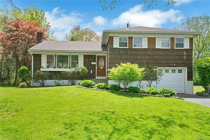 Your golden opportunity to live in the popular Tree Streets of Briarcliff Manor; Close to schools, shops, library, & parks. This cherished split-level home, nestled on a picturesque level corner lot, boasts a seamless flow from its bright living room to the dining area and eat-in kitchen. Upstairs, find the primary bedroom with bath, alongside two additional bedrooms and a hall bathroom. Descend to discover a slate-floored family room, laundry area, and a newly renovated third bathroom with access out to rear yard. Enjoy outdoor gatherings on the private patio of this level property. Recent upgrades include a new HVAC unit (2021), sump pump, furnace, waterproof basement (2021), roof (2022), paved driveway (2019), and updated lower-level bathroom (2023). Experience suburban bliss within the award winning Briarcliff Manor School District.