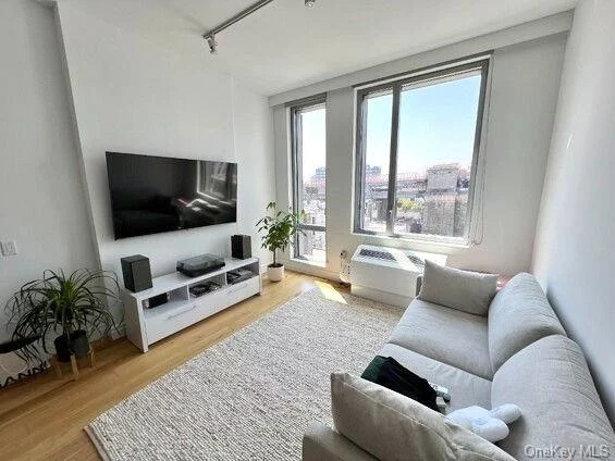 RENT-STABILIZED South Facing 1-bedroom apartment with w/d in unit and partial Bridge and water views. Apartment is located directly across from Domino Park in Williamsburg. Boasting over 700 sq ft, this unit is one of the largest one-bedroom in the building and features south-facing, huge windows that flood the space with natural sunlight.Apartment Features:Lots of closet spaceBosch in-unit washer and dryerKitchen equipped with stainless steel appliances, including a dishwasher, and ample storageWhite oak hardwood floorsCaesarstone countertops and backsplashSolar shades in both the living rooms and bedroomsIn-sink garbage disposalsHans Grohe bathroom fixturesKeyless electronic apartment accessLED energy efficient track lightingCorian window sills and high ceilingsBuilding Amenities:24-hour concierge serviceState-of-the-art fitness center with panoramic viewsLounge area with breathtaking skyline viewsRoof deck complete with BBQ grills and outdoor dining areaPackage room and cold storage facilitiesShuttle service to JMZ (Marcy Ave) and L (Bedford Ave) trainsUnrivaled views of the Williamsburg Bridge and both Brooklyn and Manhattan at largeContact me for more information