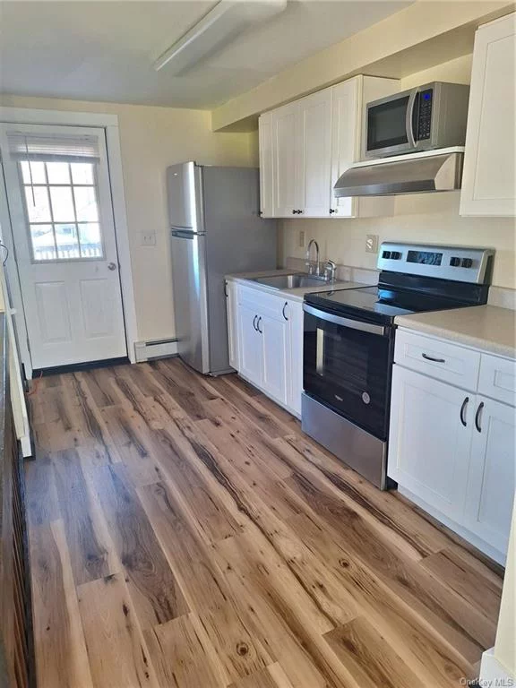 Newly renovated 1 Bedroom Apartment in the Heart of downtown Village Of Red Hook, Bright and Sunny Living Room with Large Closet, Kitchen with Stainless Appliances and access to Private deck, One Bedroom with closet and ceiling fan, plus full updated Bath and more good closet space. Central air and Heat, Private entrance to off street parking. Hot water, garbage, and internet included. Tenant pays electric. 2nd floor of quiet office. On Bard shuttle stop, Walk to restaurants, shops and all service. Available June 1.