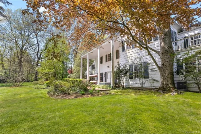 Nestled within the prestigious Edgemont School District, this exquisite Scarsdale residence presents a harmonious blend of historical charm and modern luxury. Originally constructed in 1850, the home has been thoughtfully renovated in 2014 to meet contemporary standards while preserving its timeless allure. As you approach the property, you are greeted by an elegant stone wall that ushers you towards the home, set back from the road to ensure privacy and tranquility. The expansive grounds, with their natural landscaping, offer a serene backdrop and easy access to the Greenville Elementary School. The heart of this home is the large chef&rsquo;s kitchen, boasting an inviting island with seating and a spacious breakfast area with convenient side door access from the driveway. The open-plan living and dining room with 10 ft. coffered ceilings and anchored by a stone wood-burning fireplace, seamlessly transitions to the back patio, perfect for al fresco dining and overlooking the spacious and secluded backyard. A versatile separate family room, complete with an adjacent full bath, can double as a first-floor bedroom, catering to diverse needs and lifestyles. The second floor unveils a primary bedroom suite, accessible via a private staircase from the family room, ensuring a secluded retreat. Three additional family bedrooms, two full bathrooms, and a private au pair or guest room with an en suite bath, accessed by its own staircase, complete the upper level. Embrace the blend of privacy, elegance, and convenience in this beautifully renovated home.