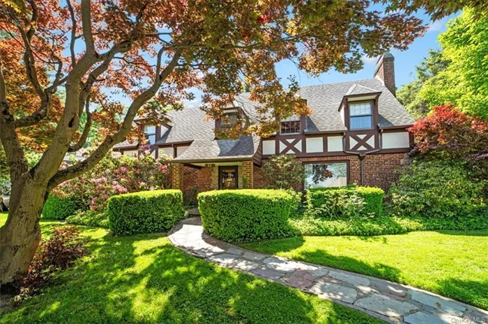 Nestled in the serene Northeast Yonkers, this Tudor gem embodies the quintessential charm and comfort of suburban living. Boasting an expansive interior, the residence offers three generously-sized bedrooms and three full baths, providing ample space for both relaxation and entertainment.   Eat in kitchen , formal dining room and living room, exudes a cozy ambiance accentuated by wood beams adorning the ceiling and original hardwood floors throughout. Beyond its spacious main level, the home offers a finished basement retreat, complete with a fireplace, perfect for cozying up on chilly evenings, and a large two-car garage providing ample storage space.  Convenience meets functionality with an additional office/den on the first floor, accompanied by a full bathroom, offering flexibility for remote work or guest accommodations. Renowned for its unparalleled beauty and architectural elegance, this home has been honored with an award from the city of Yonkers, a testament to its timeless appeal and meticulous craftsmanship.  Step outside to discover a stone patio enveloped by lush trees and vibrant plants, creating a tranquil oasis for outdoor entertaining and relaxation. A covered area provides shelter from the elements, allowing for year-round enjoyment of this picturesque setting. Whether hosting gatherings with friends or simply unwinding in nature&rsquo;s embrace, this outdoor retreat is the perfect complement to the gracious living offered within. This house is being sold as is. Well maintained, original owners, a must see!