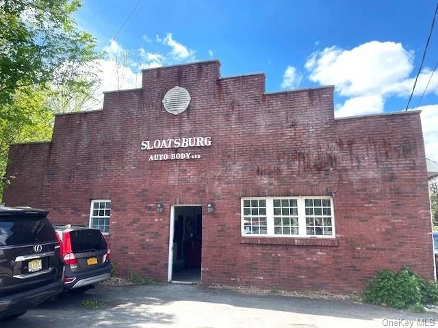 Great opportunity to purchase a 2833 square foot autobody shop located on a corner lot in the heart of Sloatsburg on Route NY-17 with great visibility. Owner has occupied the property for 50 years and is retiring. Post office is located directly across the street. Currently zoned for Autobody shop, planning board approval required for any other permitted uses attached to the listing.
