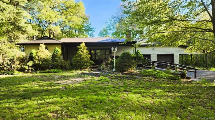 Ranch style home on nearly an acre of level property. Fireplace in living room, car port, large deck, and full basement. This is the right neighborhood to bring a home back to its glory.