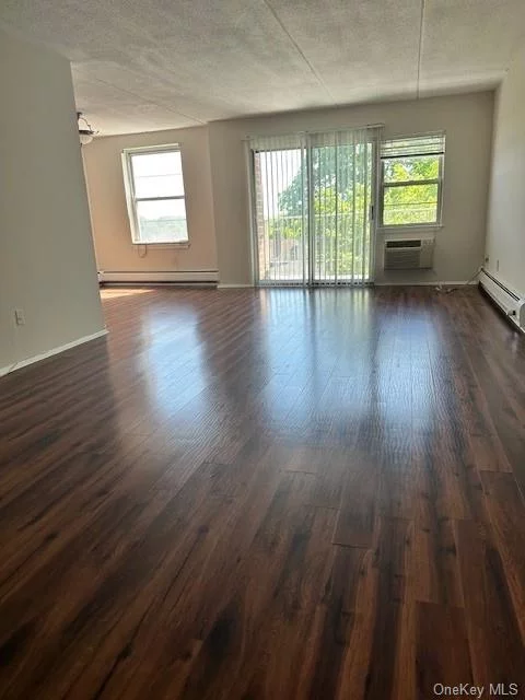 TOP LOCATION, RENOVATED, AND A COMMUTERS DREAM! Spacious 1 BR, 1 BTH, unit in the heart of vibrant downtown Suffern, close to NYC bus and rail, shopping, restaurants, park, Good Samaritan Hospital, NJ Border (Mahwah), and Harriman State Park. Offering a great lifestyle for relaxing, everyday living, entertaining, and working from home, this light filled unit features a stunning and newer eat in kitchen with white cabinetry thoughtfully designed with great storage and meal prep space, a separate dining rm, large living rm, EZ to maintain beautiful wood look flooring, a balcony with a view, updated bath, bedroom with a WIC, and three add&rsquo;l closets. Laundry on floor and 1 outdoor parking space is included. Bike storage and exercise machines on premises, heat, water, and hot water included in the rent. You will love living here!