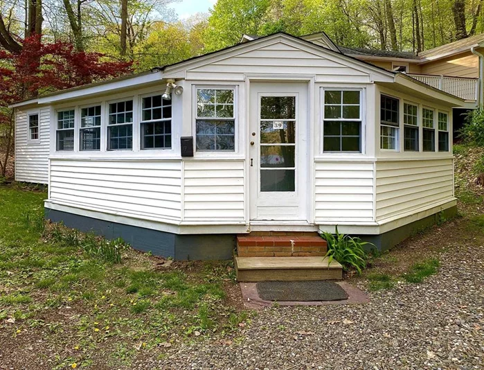 Welcome to the Lake! This is a re-done 1930&rsquo;s cottage with lake views. Lake frontage for swimming, boating, and fishing one tenth of a mile down a quiet country lane. Cottage has wonderful light with vaulted spaces. Nice kitchen/living room, bedroom, and bathroom with wraparound screened porch. All seasons are beautiful here.