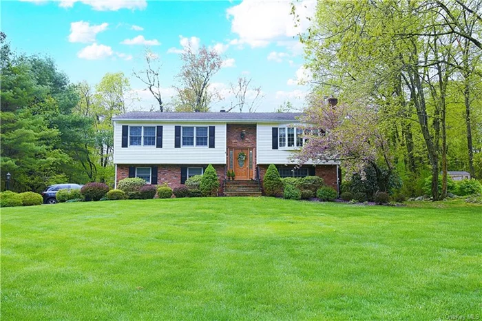 Welcome to 25 Greenway Terrace North. This beautiful well maintained home sits on nearly a half-acre lot (.46 acre). This raised ranch has a wood burning stove in the living room, formal dining room, eat-in kitchen with door off the kitchen leading to the large two-level recently re-stained/re-painted deck, as well as retractable awning. The lower level of the home has a beautiful brick walled fireplace, new doors leading to the lower half of the deck for easy access to the hot tub and fenced-in heated in-ground pool. The lower level also has a full bathroom, recreation area and den/office area, along with a door to the 1 car attached garage. The home has central air conditioning, and for heat you have the option of Oil or the Electric Heat Pump.