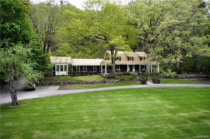 Modern-day luxury in the very first building in historic Tuxedo Park, The Hunting Lodge. Founded in 1886 built by Pierre Lorillard as a hunting preserve designated in 1980 to the National Register. Over 2 acres, this 3, 600 square foot home has 3 (possible 4) bedrooms, 2.5 baths and 3 fireplaces. Lovingly renovated sited on a gentle rise with a sweeping front lawn, offers incredible privacy. Magical tranquility best describes this home with a stunning Lap Pool and extensive gardens that include a variety of maple trees, numerous thoughtfully chosen plantings accented by magnificent historic stone walls. A Tesla charger, central AC, new appliances, new cedar roof and copper flashing integrate new world with old-world charm. In addition a potting shed completes an already inspiring residence. As you enter foyer you are immediately transported by an old world feel by a den with wood paneling, an intimate bar with inviting fireplace. Spectacular first floor Primary Bedroom Suite with soaring bead board ceiling. Gourmet Kitchen, Dining Room and Living Room all with views and access to outdoors. The Hunting Lodge is an outstanding, sophisticated full time home or weekend getaway. Surrounded by the beautiful Ramapo Mountains with Tuxedo Lake access for boating and fishing. 24/7 Gate Guarded all within 38 miles from NYC.