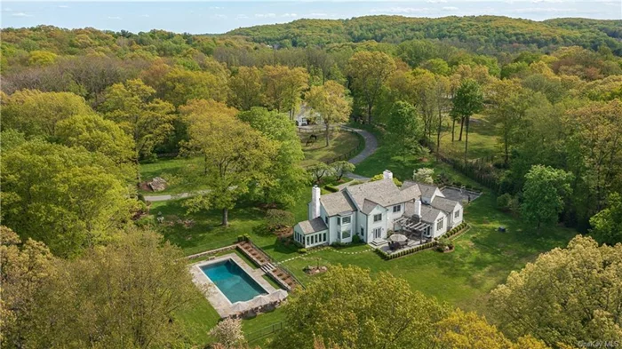 Tucked down a picturesque cul-de-sac in Bedford, this handsome colonial was expanded and renovated by architect Teo Siguenza in 2018. Offering a saltwater pool and secret garden sanctuary, it&rsquo;s a jewel of a horse farm with stable, paddocks and access to Bedford Riding Lanes. Also ideal for a buyer who envisions the barn for parties or a car collection.  Renovation highlights include cedar roof, front portico, geothermal heating/cooling, and repainted exteriors. The main house features a living room with French doors to a sunporch; the kitchen features reclaimed oak floors & premier appliances. First floor additions: family room, mudroom & bedroom suite.  The second floor&rsquo;s primary suite offers a bedroom with a grand window seat and walk-in wardrobe. Anchoring this floor is a large adaptable space, embellished with lattice windows and arched ceiling. Between the renovated home, barn, trails, and pool, this is a most coveted country option. 1 hour to NYC via major roads & Metro-North.