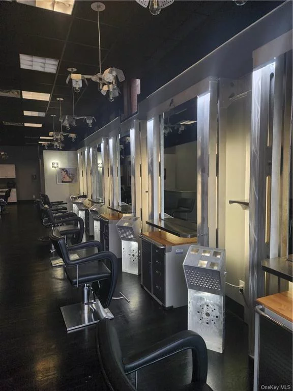 Modern style turnkey hair/nail salon space located in the Arlington Town Center near Vassar College. Features 7 cutting stations plus 2 wash stations, kitchenette, reception/waiting area. Many recent upgrades, including lighting, ceiling, stations, flooring, paint.