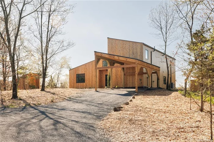 Newly built with craftsmanship and attention to detail, this contemporary home offers a modern take on country living. The entry takes one in to the dramatic great room with soaring ceilings, radiant heated polished concrete floors and french doors opening to a spacious blue stone terrace. This room provides for living with a woodstove for cozy gatherings and dining showcasing a chefs kitchen with custom made cabinetry, marble counter tops and Miele appliances. The primary bedroom is found on this level and has an ensuite bath and access to the outside patio. Additionally on the first level, there is a den/office and a powder room with laundry. Upstairs there is hardwood flooring and two generous bedrooms both with cathedral ceilings and one with captivating views of the distant hills. A beautifully appointed full bath completes this floor. The outdoors is open with plenty of space for lawns, gardens or a pool and has pretty vistas looking to the south and the east. All is located just minutes to Rhinebeck, convenient to the Taconic Parkway and all of the food and culture to be enjoyed in the Hudson Valley.