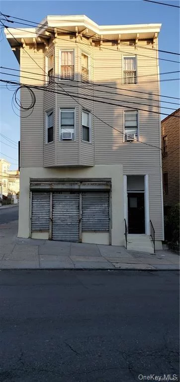 Investor&rsquo;s / Contractor&rsquo;s dream. Mix use ready for construction 3 floors property with two 3 over 3 apartments and laundromat with additional space on the first floor. Approved plans