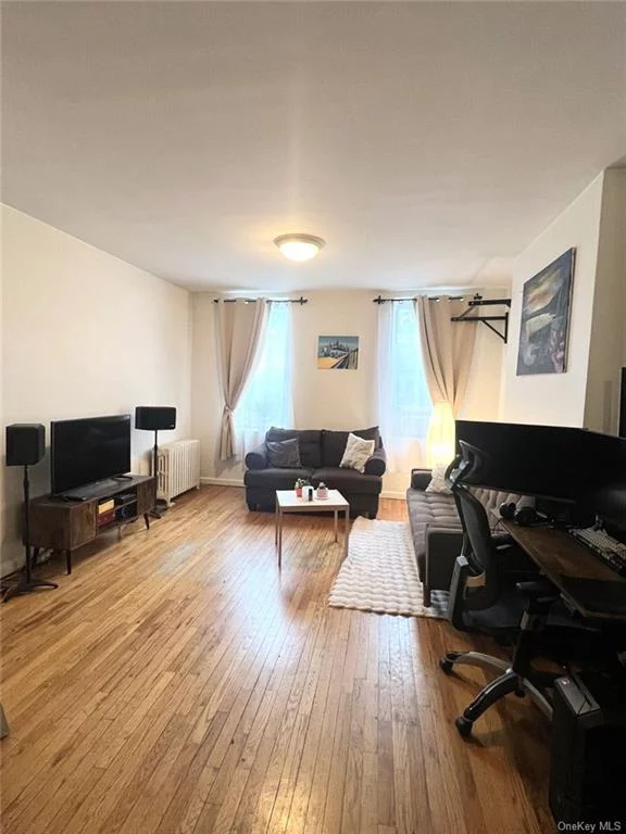 Beautiful spacious 1 Bedroom floor through apartment available June 1st! Open kitchen with stainless steel appliances Hardwood floors throughout Bedroom with large double closets Great sunlight
