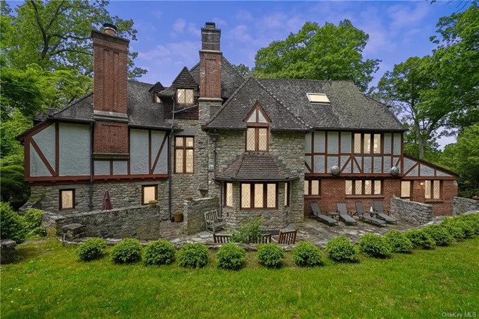 An architectural masterpiece of French influence and design. This stunning Normandy Tudor offers unparalleled security, tranquility and grandeur. Nestled within the exclusive enclave of Katonah, Cobble Court is accessible solely through guarded gates & stone pillars. Perched on over 17 acres, this home was envisioned by the award-winning architect Lester Beach Scheide and built with the finest European materials. This home showcases nearly 7, 000 sq ft of superior craftsmanship, custom built ins by John Langenbacher and stained-glass windows by the artist Daniel Cottier. This home truly reflects an era when homes were built with personal pride, quality and understated elegance. A one-of-a-kind classic turret entrance welcomes you home! Grand Foyer with granite flooring, formal living room & formal dining room both have coffered ceilings. Expansive breakfast nook, kitchen fit for entertaining, bespoke wood cabinets, 5 bedrooms, the private primary wing has 2 walk in closets and bathrm w/dual sinks, shower and whirlpool tub. 3rd Floor Has a vaulted coffered ceiling which can be anything you want it to be. As a bonus, it has a whole house generator and 3 car garage. Newly built 2 story studio/guest or pool house which has its own 2 car garage and whole house generator. Step outside to the picturesque grounds. Outdoor space includes a fishing pond, brook, Firepit, hiking trails, heated inground pool w/patio, 2 Tennis Courts & Basketball hoops. Multiple spacious private stone patios, built in barbecue grill with outdoor dining area and lush landscaping, conjuring a lavish retreat ambiance. All Meticulously crafted to meet the exact standards of the most discerning buyers. Whether hosting lavish gatherings or enjoying quiet moments of reprieve, every aspect of this property speaks to sophistication. This property also enjoys exceptionally low annual taxes of $65, 400. Proposed plans attached are for a 3-story addition. Square footage includes the guest/pool house. Plans included are for an open concept kitchen, formal living rm, primary suite, lower-level exercise room and roof top terrace!