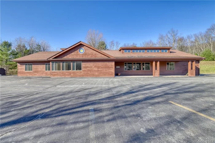 Large (5525 sf) open plan building formerly used as a medical office. Quite close to Garnet Catskills hospital and just off I-86 Exit 102. Built to high quality standards. There are eight exam rooms 10x12 and 10x10; several larger executive offices; a staff break room/kitchenette/lavatory; large reception waiting area; locker rooms and public lavatories. There is ample paved parking, and the building is attractive, pleasant and in good condition. NOT JUST FOR MEDICAL, MANY ADD&rsquo;L POTENTIAL USES: Day care, Physical Therapy, Spa, Cannabis dispensary, Art Gallery, General offices for Accountants, legal or other, Dentistry, Backoffice showroom for NYS firm doing business in Sullivan County. This building is very versatile. Sale also includes parcel 14.-1-16; total 3.6 +/- acres