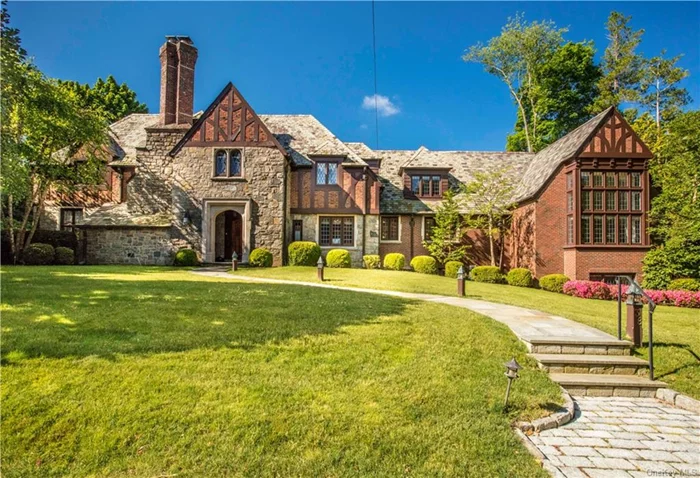 This Stunning Tudor with slate roof sits on a private, landscaped .43 acres in the heart of Fox Meadow, steps away from the Fox Meadow Elementary School and Scarsdale High School. 7, 500 square feet filled with sunlight showcases the most spectacular vaulted ceiling Family room with double story leaded windows, wood burning stone fireplace and custom Oak built in.The formal stone front vestibule entry welcomes you into a mod foyer with custom stenciled oak floors and Venetian plaster walls. Five bedrooms, five and a half bathrooms with back staircase, this home boasts expansive entertaining spaces along with custom millwork, leaded stained glass windows, seamlessly paired with modern amenities. Chefs kitchen with butlers pantry that opens into the spectacular family room and exquisite formal Dining Room. The step down formal Living Room boasts 9&rsquo; ceilings and chic fireplace. Primary bedroom with Waterworks spa bathroom and radiant heated floor plus 4 other bedrooms/3 bathrooms complete the second floor. The lower level has two sides and two access points. A full finished bonus room with double exposure windows, stone fireplace and full bathroom. Laundry room and recreation room with multiple closets and storage. Majestic and exceptional this home is in move in condition.